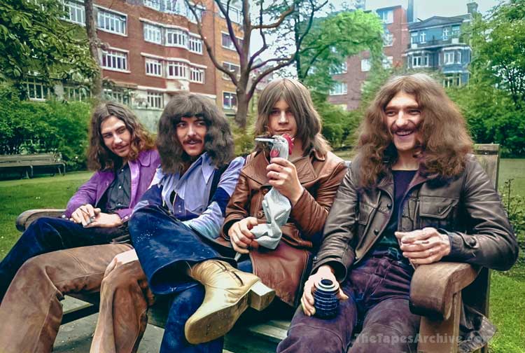 1970 Black Sabbath sitting on a bench.